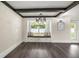 Sitting nook with a window seat in a living room with hard floors, and decorative lighting at 6600 Sw 109Th Ln, Ocala, FL 34476