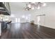 Living area and kitchen with hard floors, modern lighting, kitchen island, and stainless appliances at 6600 Sw 109Th Ln, Ocala, FL 34476