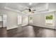 Spacious main bedroom with windows, a ceiling fan, coffered ceilings, and luxury vinyl plank flooring at 6600 Sw 109Th Ln, Ocala, FL 34476