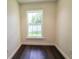 Small room with dark floors and bright window providing natural light at 6600 Sw 109Th Ln, Ocala, FL 34476