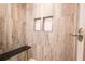 Modern shower with wood-style tile and a built-in bench at 6600 Sw 109Th Ln, Ocala, FL 34476