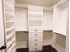 Walk-in closet features custom shelving, drawers, and ample storage space at 6600 Sw 109Th Ln, Ocala, FL 34476