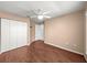 Bedroom with wood-look flooring, closet and neutral paint colors at 6758 Sw 114Th Street Rd, Ocala, FL 34476