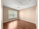 Empty bedroom with a ceiling fan, wood-look floors, and bright natural light at 6758 Sw 114Th Street Rd, Ocala, FL 34476