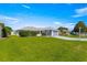 Charming single-story home with a well-manicured lawn and attached garage at 6758 Sw 114Th Street Rd, Ocala, FL 34476