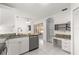 Bright kitchen features granite countertops, a desk area, stainless steel appliances and tiled floors at 6758 Sw 114Th Street Rd, Ocala, FL 34476