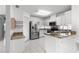 Bright kitchen features stainless steel appliances, granite countertops and white cabinets. Plenty of storage space at 6758 Sw 114Th Street Rd, Ocala, FL 34476