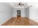 Open-concept living area with hardwood floors and tray ceilings, perfect for entertaining at 6758 Sw 114Th Street Rd, Ocala, FL 34476