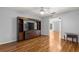 Living room featuring wood floors and a built-in entertainment center at 6758 Sw 114Th Street Rd, Ocala, FL 34476