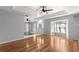 Bright and airy living room with hardwood floors, tray ceiling, and a large bay window at 6758 Sw 114Th Street Rd, Ocala, FL 34476