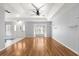 Large living room with hardwood floors, tray ceilings, and lots of natural light at 6758 Sw 114Th Street Rd, Ocala, FL 34476