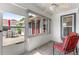 Enclosed patio with tile floors and view of the backyard at 6758 Sw 114Th Street Rd, Ocala, FL 34476