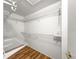 Walk-in closet with built-in shelving and wood floors at 6758 Sw 114Th Street Rd, Ocala, FL 34476