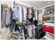 Walk-in closet with dual-tiered hanging rods, shelving and a variety of storage options at 6858 Sw 111Th Loop, Ocala, FL 34476