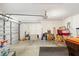 Open garage area with ample space and garage door at 6858 Sw 111Th Loop, Ocala, FL 34476