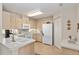 Bright kitchen features plenty of cabinet space, white appliances and a double sink at 6858 Sw 111Th Loop, Ocala, FL 34476
