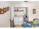 Laundry closet featuring a washing machine, dryer, storage shelves, and is conveniently located near the kitchen at 6858 Sw 111Th Loop, Ocala, FL 34476