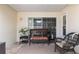 Outdoor patio with brick flooring and features a wicker bench with cushions, perfect for outdoor relaxation at 6858 Sw 111Th Loop, Ocala, FL 34476