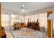 Bright sunroom features tile floor, fan, and windows providing ample natural light at 6858 Sw 111Th Loop, Ocala, FL 34476