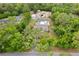 Aerial view of the property showing the house with pool and numerous sheds on the rear of the property at 8130 Sw 209Th Court Rd, Dunnellon, FL 34431