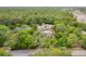 A scenic aerial view showing the house situated on a sprawling, tree-lined lot at 8130 Sw 209Th Court Rd, Dunnellon, FL 34431