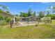 The fenced backyard has a screened pool, patio area, and lush landscaping with a storage shed at 8130 Sw 209Th Court Rd, Dunnellon, FL 34431