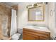 Renovated bathroom featuring a tiled shower with glass door, and modern vanity at 8130 Sw 209Th Court Rd, Dunnellon, FL 34431