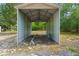 Open carport with metal frame offering covered parking or storage on the property at 8130 Sw 209Th Court Rd, Dunnellon, FL 34431