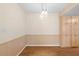 Dining room featuring wood flooring, built-in cabinets, and modern light fixture at 8130 Sw 209Th Court Rd, Dunnellon, FL 34431