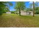 Exterior shot of the house with a two car garage and a separate storage building on the side lot at 8130 Sw 209Th Court Rd, Dunnellon, FL 34431