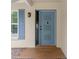 Close up of the front door with decorative details, window and adjacent sidelight at 8130 Sw 209Th Court Rd, Dunnellon, FL 34431