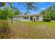 Charming single story home with a two car garage and well-maintained front yard at 8130 Sw 209Th Court Rd, Dunnellon, FL 34431