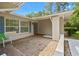 Welcoming front porch with brick flooring and charming curb appeal at 8130 Sw 209Th Court Rd, Dunnellon, FL 34431