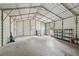 Open metal garage featuring plenty of storage and workspace at 8130 Sw 209Th Court Rd, Dunnellon, FL 34431