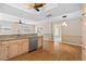 An updated open kitchen featuring stainless appliances, wood cabinetry, and granite countertops at 8130 Sw 209Th Court Rd, Dunnellon, FL 34431