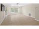 Bright living room with tile flooring, natural light, and neutral paint at 8130 Sw 209Th Court Rd, Dunnellon, FL 34431