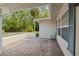 Inviting covered patio with brick flooring, perfect for outdoor seating and relaxing at 8130 Sw 209Th Court Rd, Dunnellon, FL 34431