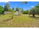 Ground level view of three of the multiple storage buildings located at the rear of the property at 8130 Sw 209Th Court Rd, Dunnellon, FL 34431