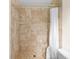 Updated bathroom showcasing a tiled shower with a built-in seat and a shower curtain at 8130 Sw 209Th Court Rd, Dunnellon, FL 34431