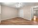 Neutral bedroom featuring wood-look flooring, a ceiling fan, and double door closet at 8569 Sw 92Nd Ln # D, Ocala, FL 34481