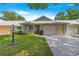 Charming single-story home featuring an attached two-car garage and well-maintained lawn at 8569 Sw 92Nd Ln # D, Ocala, FL 34481
