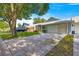 Street view of a well-maintained home with a two-car garage and a concrete driveway at 8569 Sw 92Nd Ln # D, Ocala, FL 34481