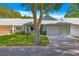 Inviting single-story home with a well-manicured lawn, and an attached two-car garage at 8569 Sw 92Nd Ln # D, Ocala, FL 34481
