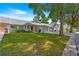 Well-maintained homes with green lawns, attached garages, and mature shade trees at 8569 Sw 92Nd Ln # D, Ocala, FL 34481