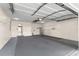 Spacious garage featuring ample room, storage shelves, and interior access to the home at 8569 Sw 92Nd Ln # D, Ocala, FL 34481