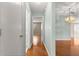 Hallway leading to the rooms, showcasing the lovely wood-look flooring at 8569 Sw 92Nd Ln # D, Ocala, FL 34481