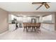 Bright kitchen showcasing white cabinets, stainless appliances, and breakfast bar seating at 8569 Sw 92Nd Ln # D, Ocala, FL 34481