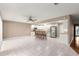 Open layout kitchen with white cabinets, stainless steel appliances, and breakfast bar at 8569 Sw 92Nd Ln # D, Ocala, FL 34481