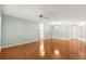Expansive living area showcasing hardwood floors, a ceiling fan, and an open layout at 8569 Sw 92Nd Ln # D, Ocala, FL 34481
