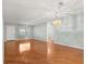 Bright living room with hardwood floors, a ceiling fan, and views of adjacent spaces at 8569 Sw 92Nd Ln # D, Ocala, FL 34481
